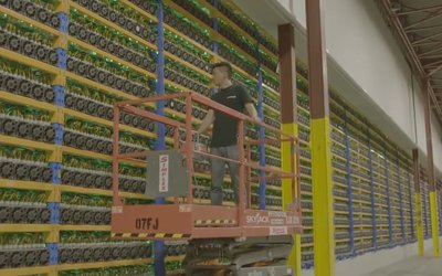 Rows of mining machines working within a large-scale mining farm