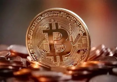 Bitcoin logo surrounded by solar panels